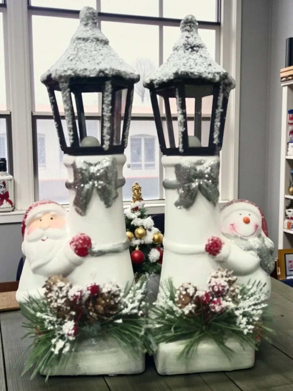 Snow Lantern Christmas Figurine Set | Santa & Snowman with Pinecones & Snowy Greens – Festive Table Décor Pack of 2