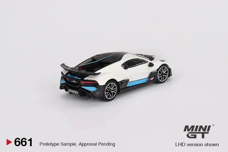 White and blue collectible toy sports car model MINI GT on plain background