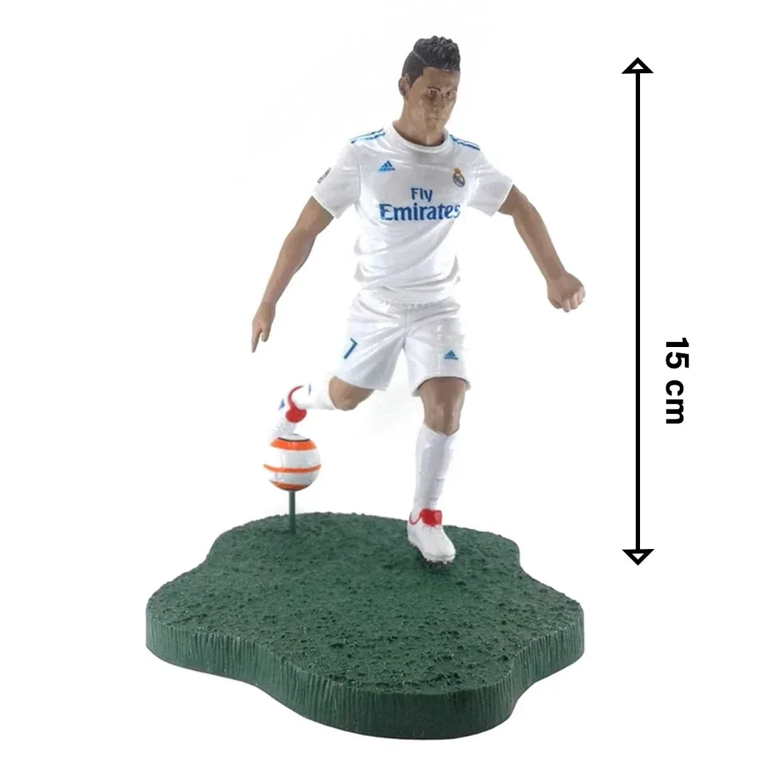 Soccer player action figure in white uniform with ball on green base, 15 cm tall