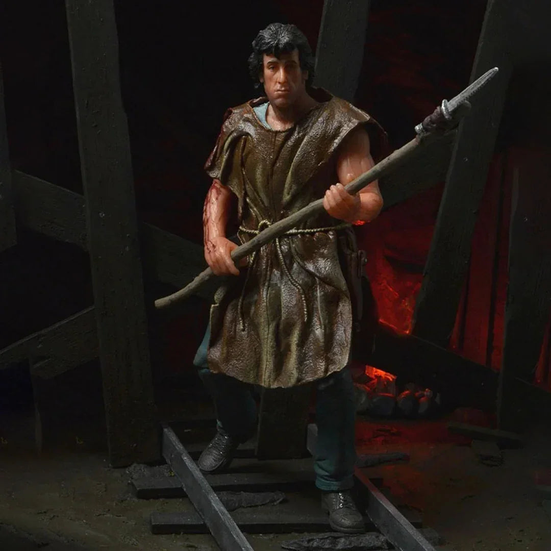 Realistic action figure holding a spear, wearing a rugged tunic, posed in a dark, dramatic setting
