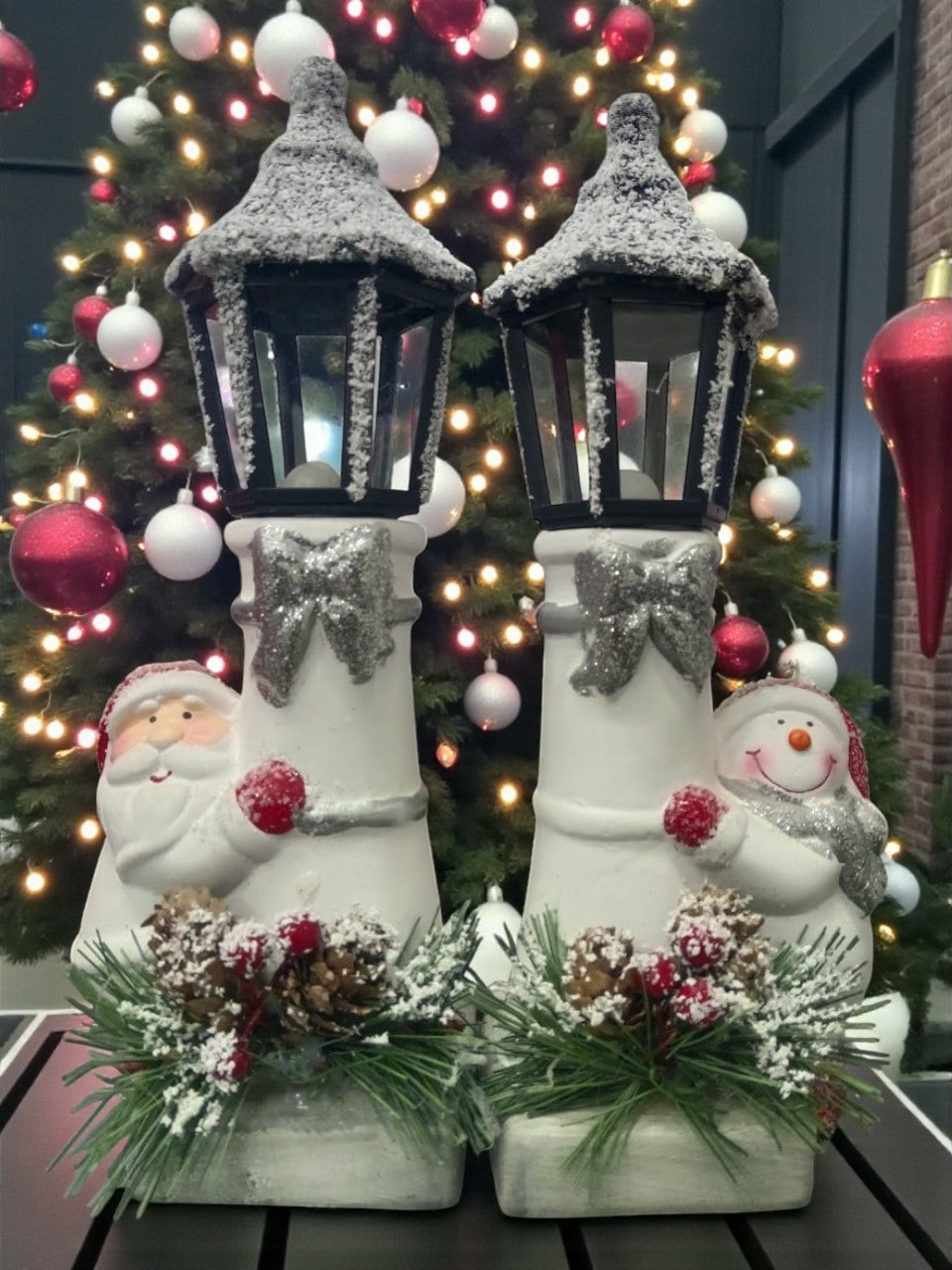 Snow Lantern Christmas Figurine Set | Santa & Snowman with Pinecones & Snowy Greens – Festive Table Décor Pack of 2