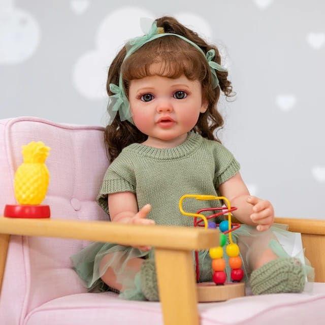 Lifelike Reborn Baby Girl Doll – Toddler with Realistic Sound & Brown Hair And Light Green Knitted Outfit With A Soft Net Skirt