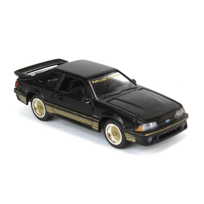 GreenLight 1:64 Scale  1988 Ford Mustang Fox Body SLN – Black & Gold, LP Diecast Garage Exclusive