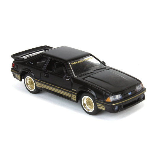 GreenLight 1:64 Scale  1988 Ford Mustang Fox Body SLN – Black & Gold, LP Diecast Garage Exclusive