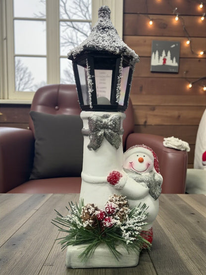 Snow Lantern Christmas Figurine Set | Santa & Snowman with Pinecones & Snowy Greens – Festive Table Décor Pack of 2