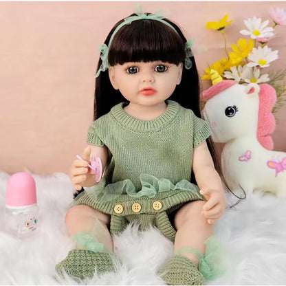Lifelike Reborn Baby Girl Doll – Toddler with Realistic Sound & Brown Hair And Light Green Knitted Outfit With A Soft Net Skirt