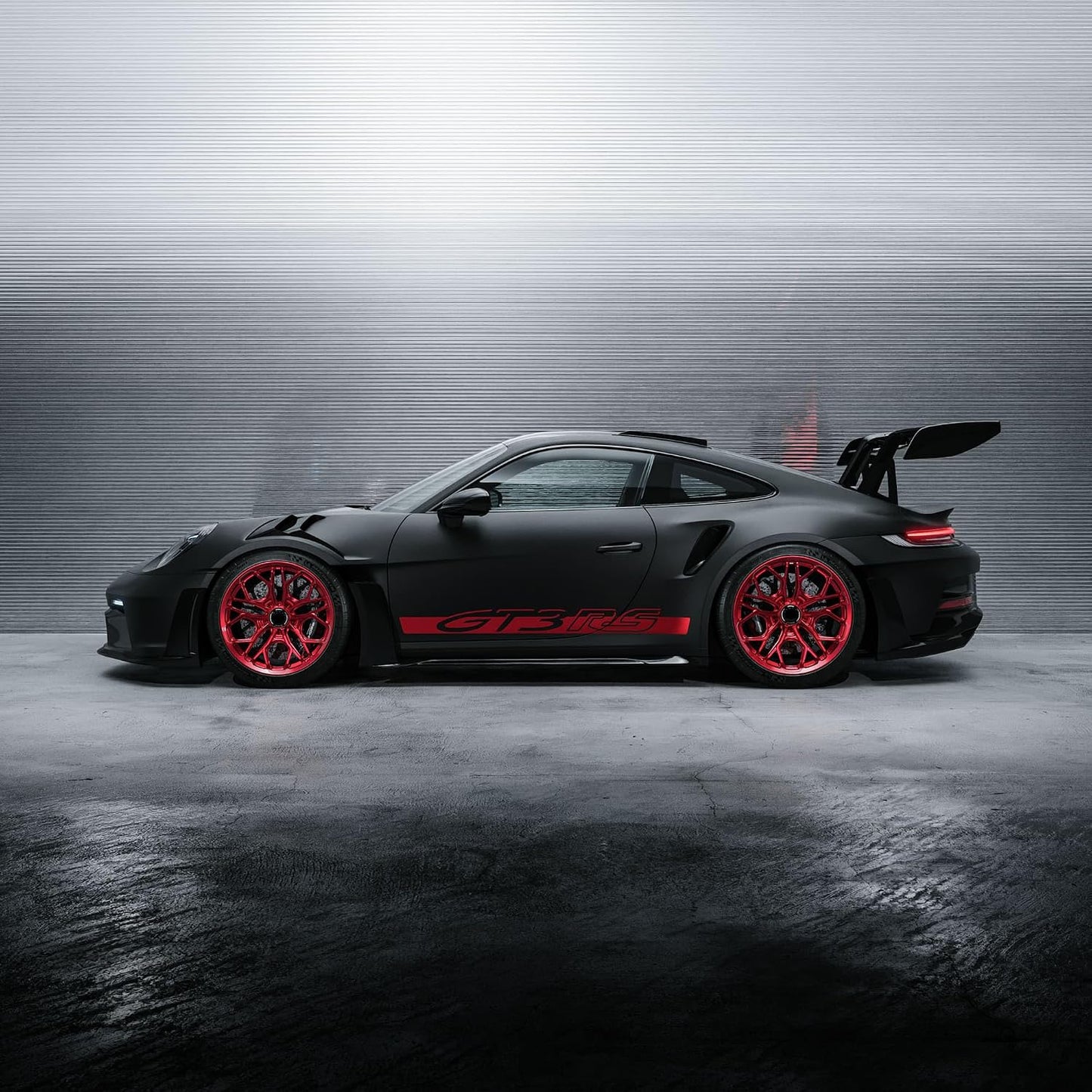 Bburago 1:43 Porsche 911 GT3 RS Die-Cast Model Car | Metal Collectible Sports Car with Red Wheels, Racing Graphics & Display Base – Black, Ages 14+