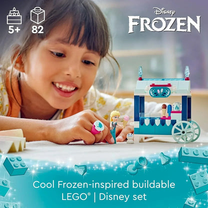 Girl playing with LEGO Disney Frozen buildable ice cream cart set, suitable for ages 5 and up.