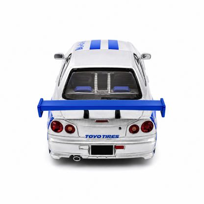 Time Micro 1:64 Nissan Skyline GT-R R34 C-West Silver & Blue Die-Cast Model Car | JDM Japanese Racing Sports Car Miniature | Detailed Collectible Scale Model with Racing Livery Display Box | Premium Nissan R34 Diecast Car for Collectors & Display