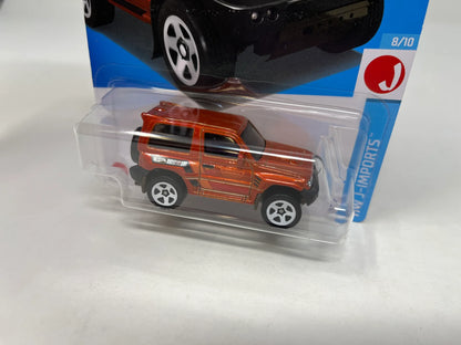 "Unleash the Adventure: Mitsubishi Pajero Evolution 169 - Orange 2024 Hot Wheels Edition"