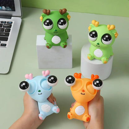 Squishy Dinosaur with Pop-Out Eyes Funny Dragon Pinch Toy 4 Pieces - Jaiman Toys