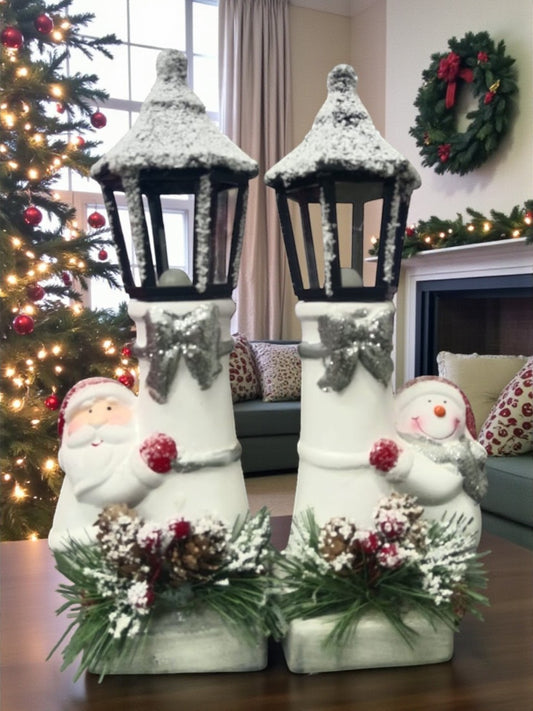 Snow Lantern Christmas Figurine Set | Santa & Snowman with Pinecones & Snowy Greens – Festive Table Décor Pack of 2