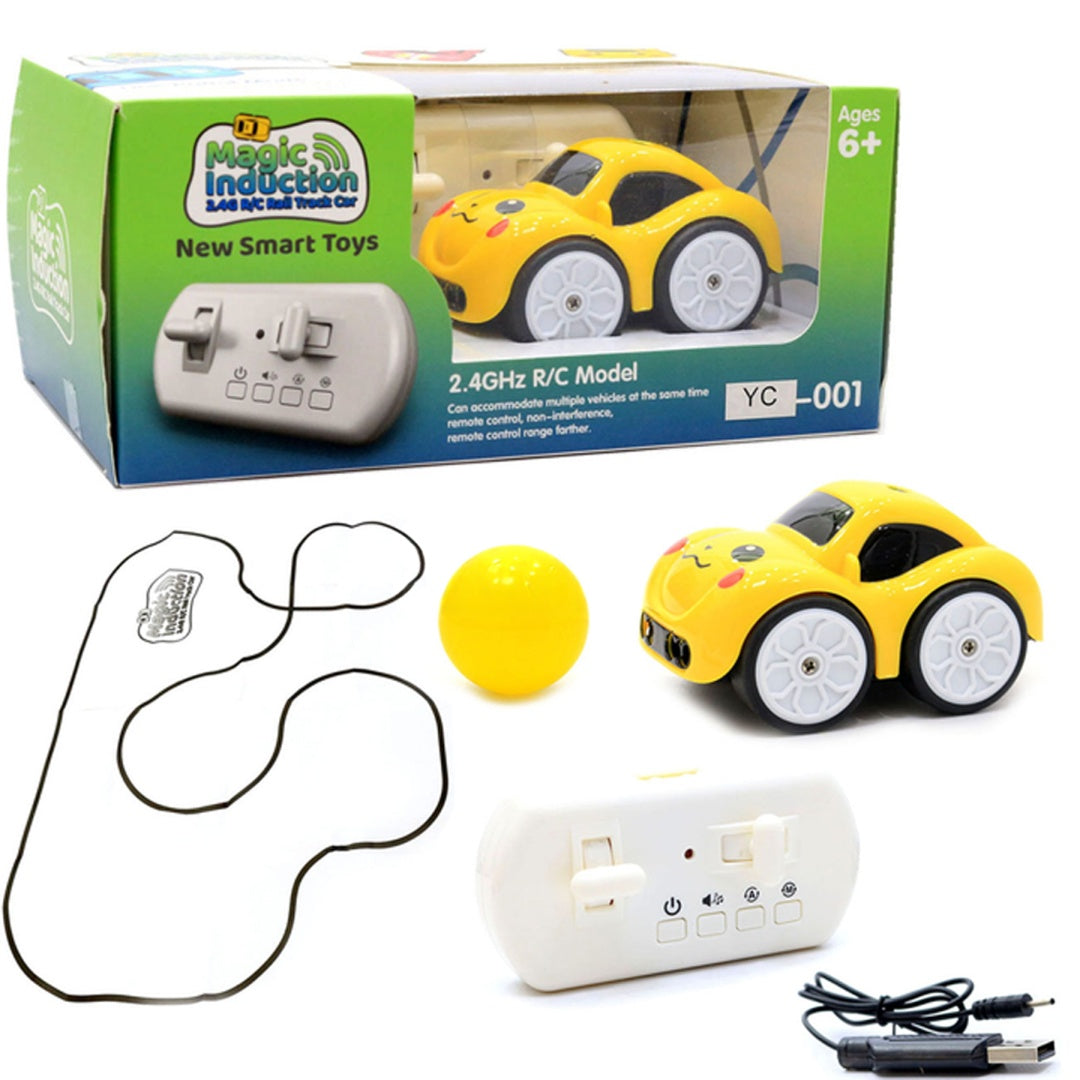 Yellow toy car with remote control, ball, and packaging on a white background